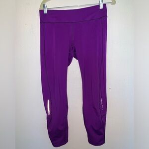 Bright purple crop leggings. Has tiny hole where the tag was I post a picture.